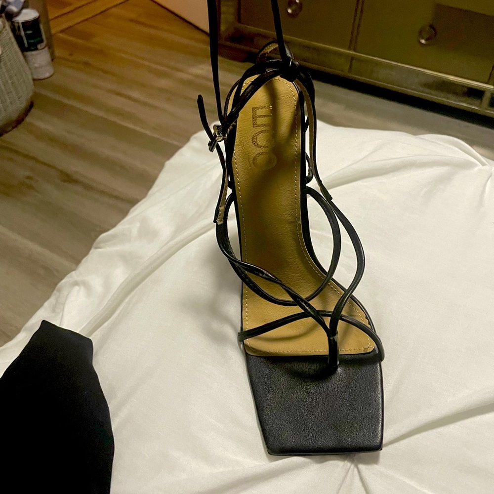 Black strap up heels